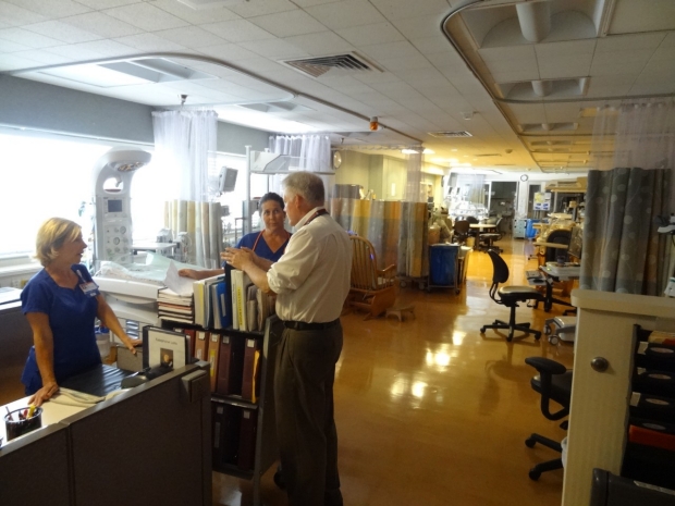 Dr. McNamara speaking with two nurses in the Dominican Hospital NICU